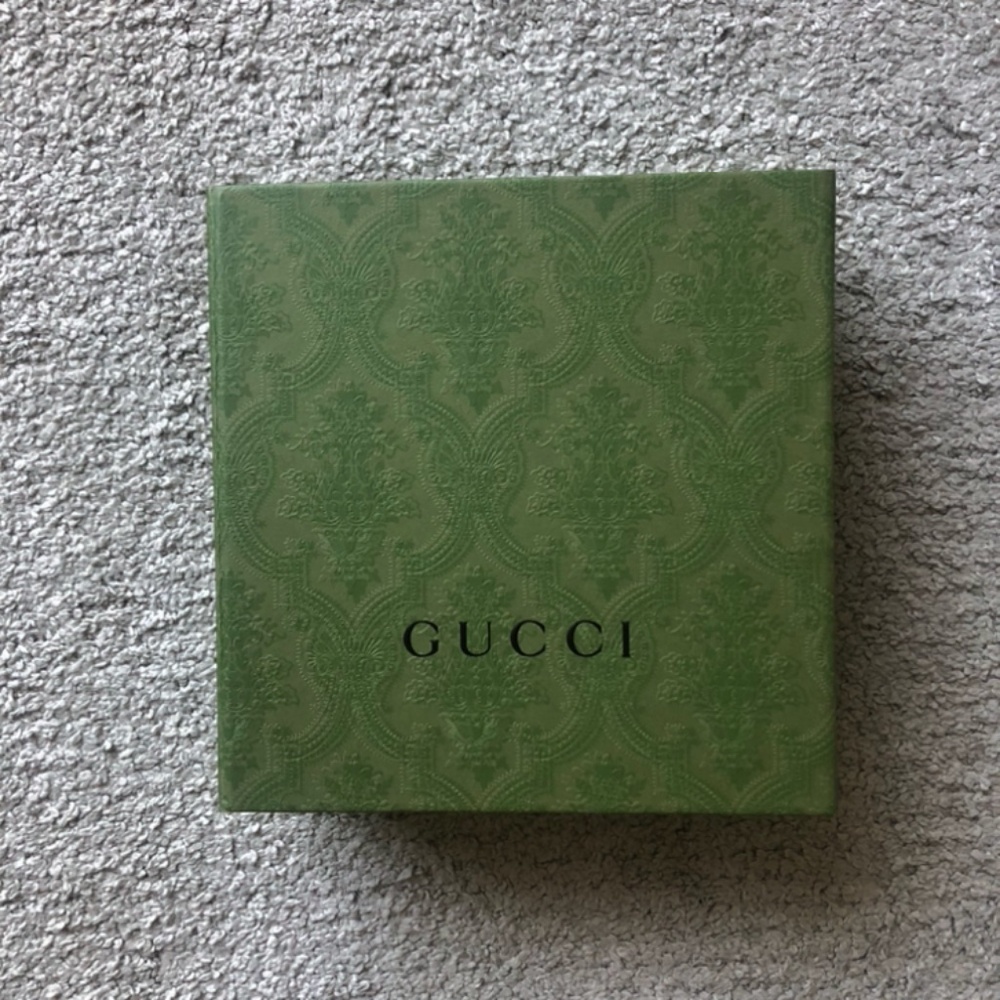 Authentic Gucci Embossed Magnet Closure.